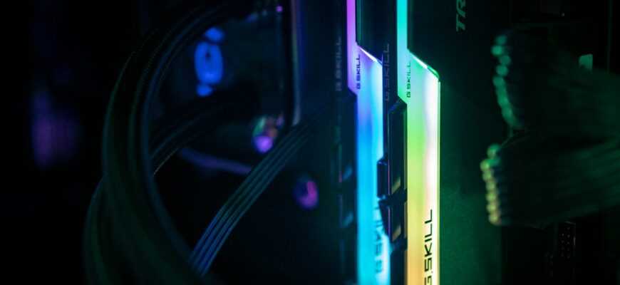 a close up of a computer and wires in a dark room