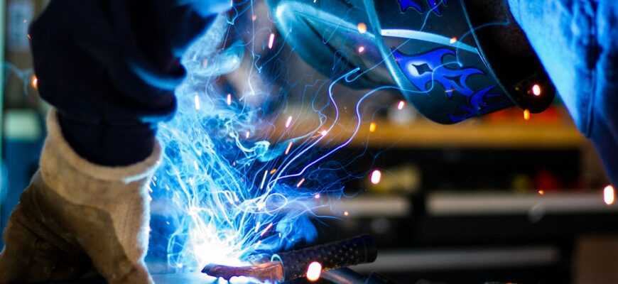 man holding gray steel frame