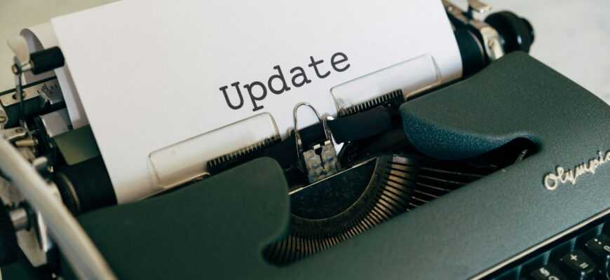 white printer paper on green typewriter