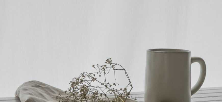 white ceramic mug on table