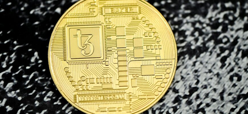 a close up of a coin on a black surface